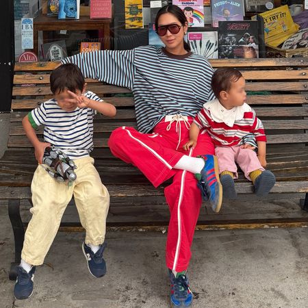 Woman in a striped tee and red pants
