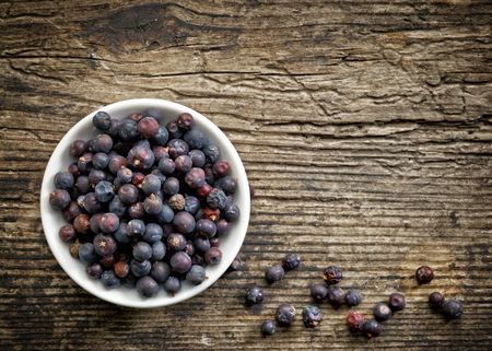 White Bowl Full Of Juniper Berries