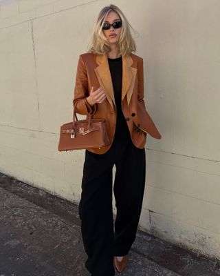 A picture of Elsa Hosk wearing a Hermès Birkin. She is one of the many celebrities who carry a Birkin bag.