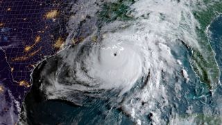 We see a satellite image of Hurricane Ida hitting Louisiana.