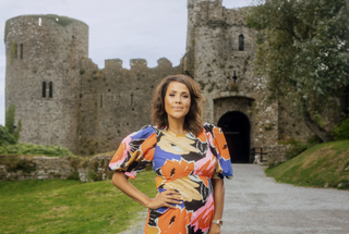 Key to a Fortune host Jean Johansson posing outside a castle