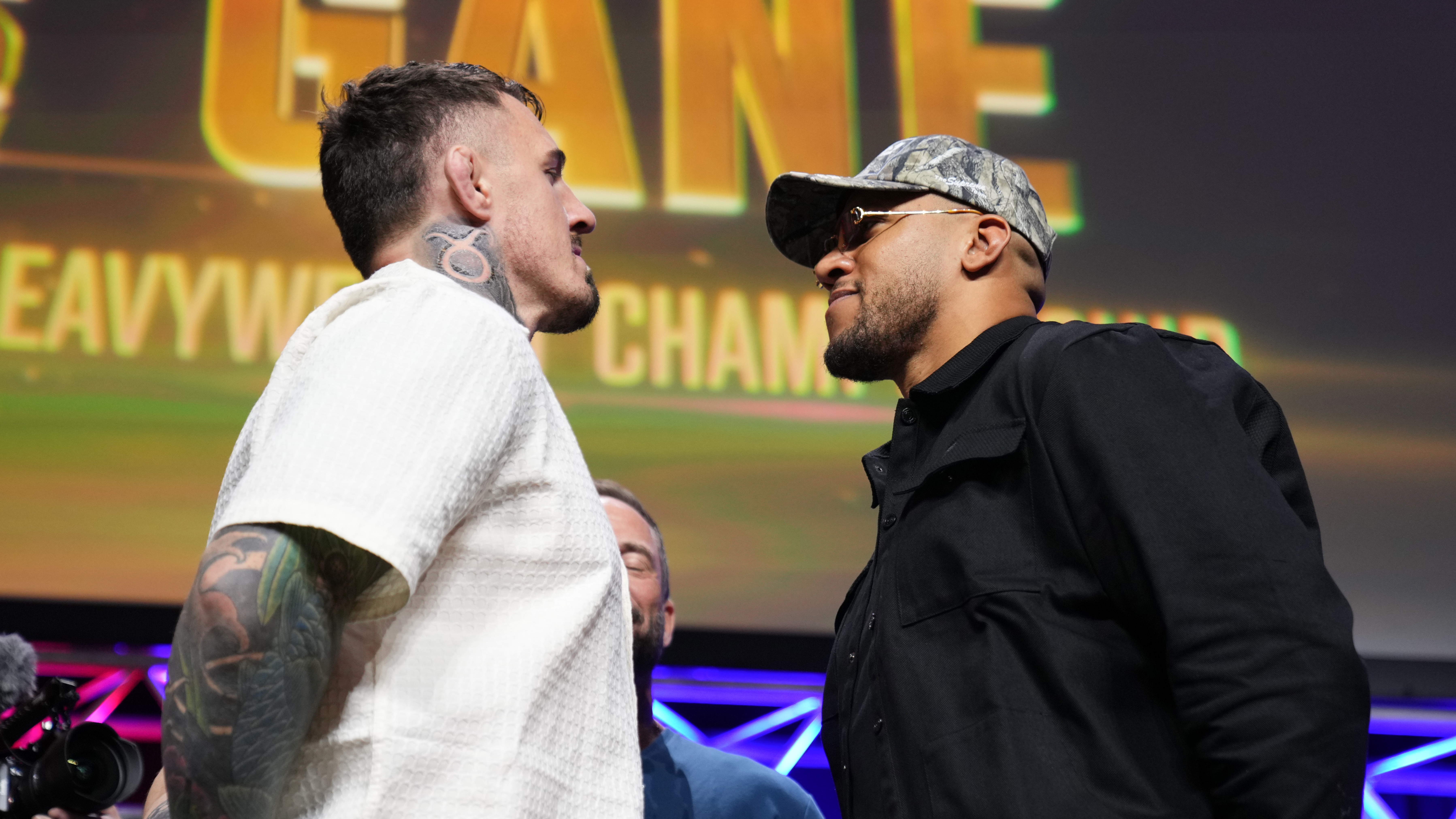 Tom Aspinall facing off vs Ciryl Gane at the UFC 321 press conference.