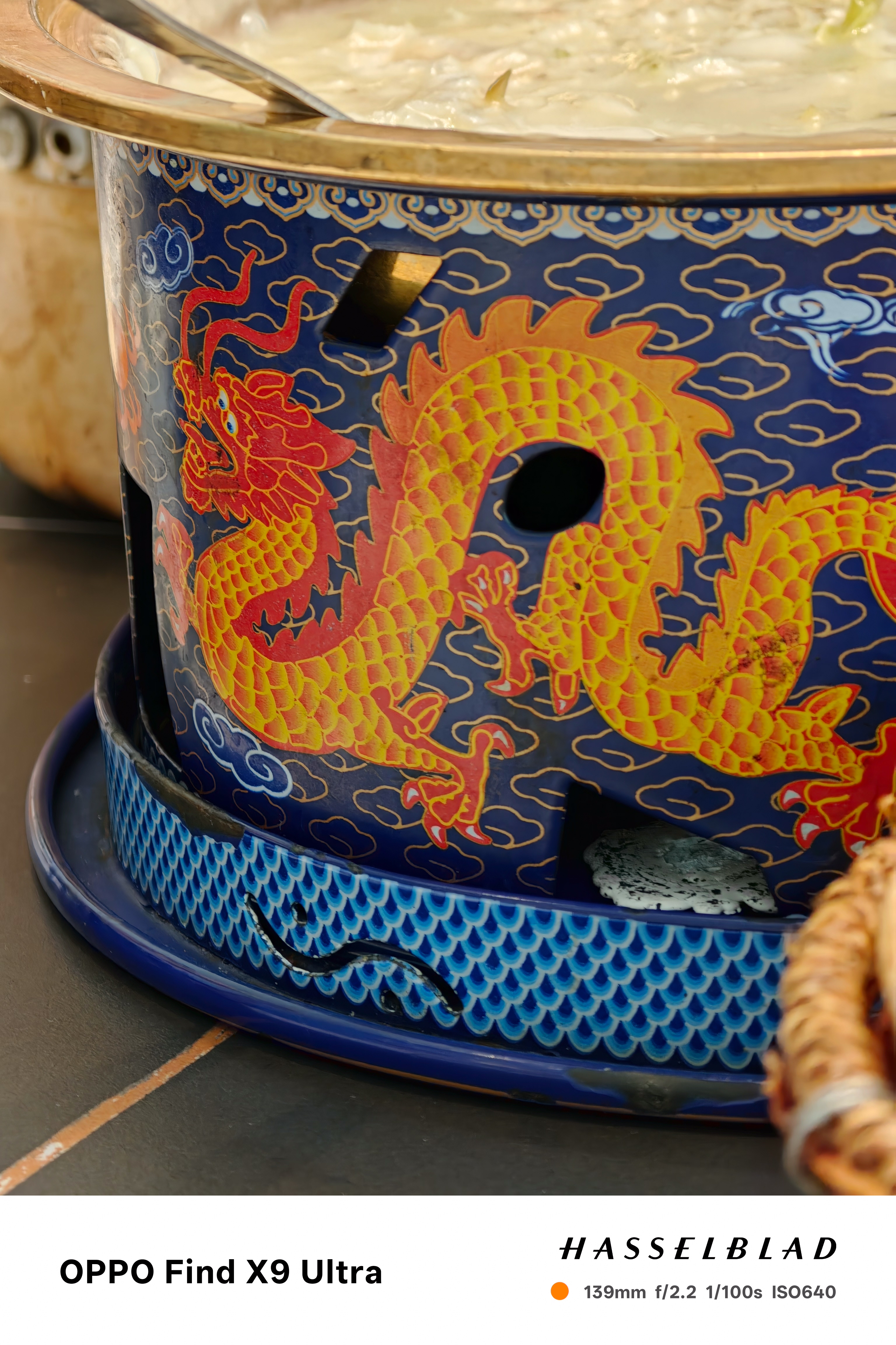 Decorative hot pot base with a bright yellow dragon motif on blue enamel