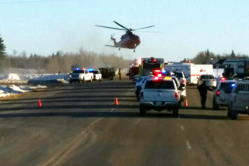 Tmergency crews responding to the scene where a bus carrying a junior hockey team to a playoff game was struck by a semi Friday, April 6, 2018