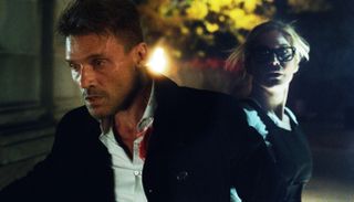 Frank Grillo and Elizabeth Mitchell on the run in The Purge: Election Year.
