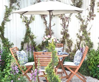 garden furniture set with planting in courtyard garden