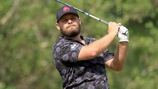Tyrrell Hatton takes a tee shot in the final round of the US Open