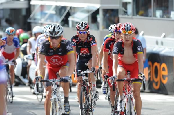 Lance Armstrong (RadioShack) crosses the line in disappointment, alongside Christophe Moreau (Caisse d'Epargne) and Janez Brajkovic (RadioShack)