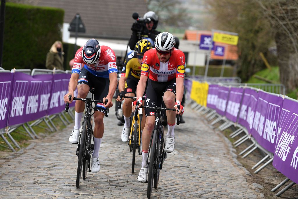 OUDENAARDE BELGIUM APRIL 04 Mathieu Van Der Poel of Netherlands and Team AlpecinFenix Kasper Asgreen of Denmark and Team Deceuninck QuickStep Wout Van Aert of Belgium and Team Jumbo Visma during the 105th Ronde van Vlaanderen Tour of Flanders 2021 Mens Elite a 2515km race from Antwerp to Oudenaarde Oude Kwaremont Cobblestones Sector RVV21 rondevanvlaanderen tourofflanders on April 04 2021 in Oudenaarde Belgium Photo by Tim de WaeleGetty Images
