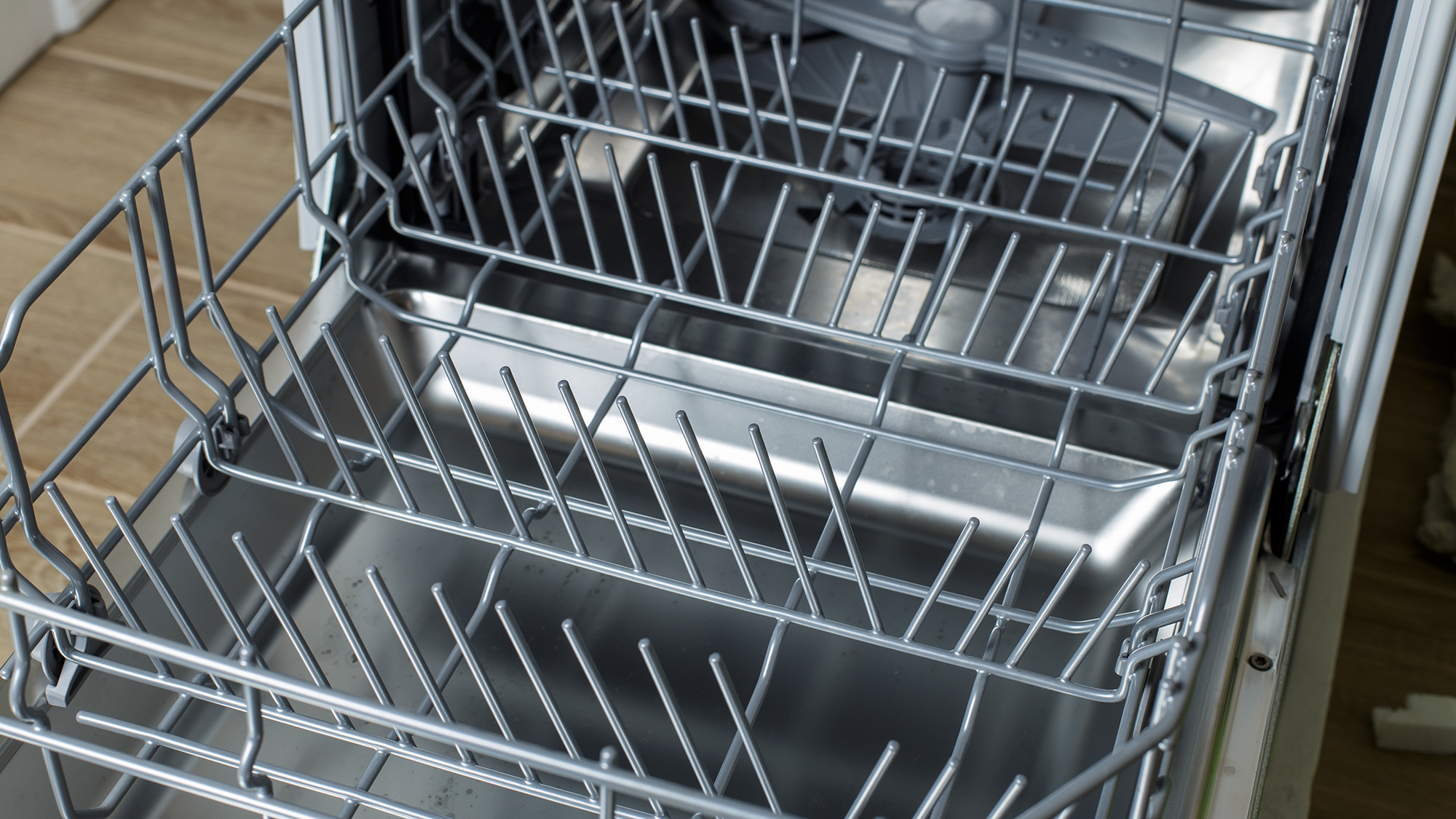 Open dishwasher showing lower rack pulled out