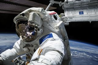 Astronaut Wearing the Proposed International Flag of Earth