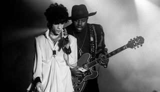 Prince (left) and Levi Seacer Jr perform onstage at Brabanthallen in Den Bosch, Netherlands on August 9, 1992