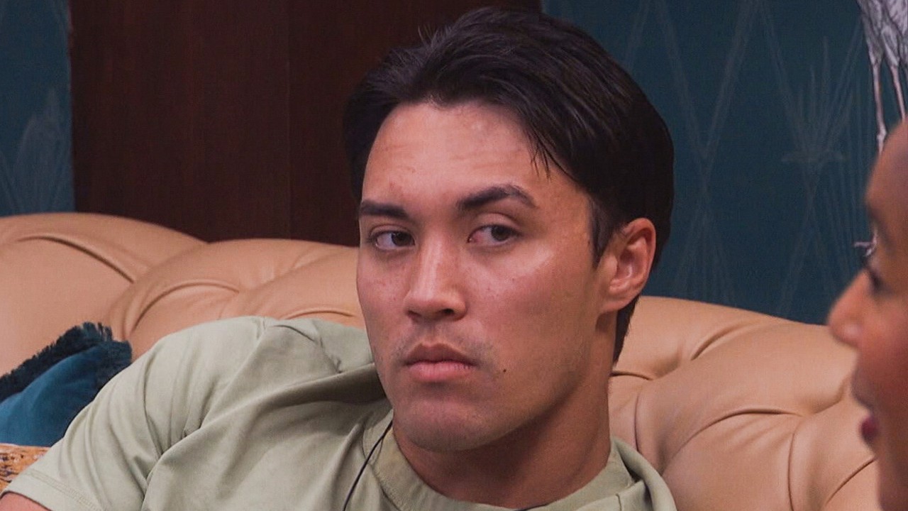 Zach looking intently at Ashley as she speaks.