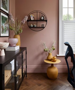 earthy pink home office with black accents