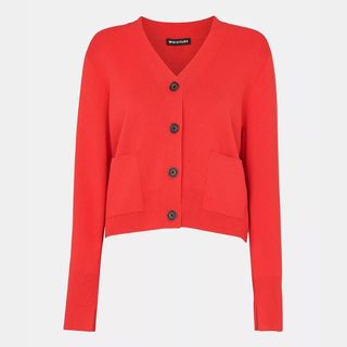 A cut out of a red cardigan from Whistles on a white background