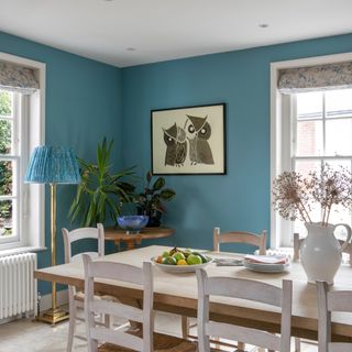 dining table with chair and wall painting
