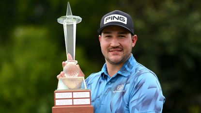 Thriston Lawrence with the trophy after winning the 2021 Joburg Open