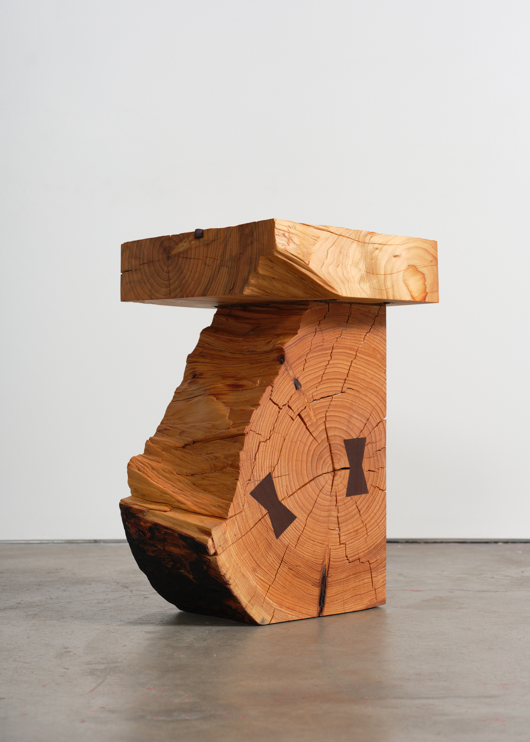 wooden stool by Vince Skelly, made of wood salvaged from the LA wildfires