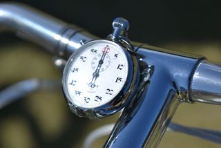 a stopwatch seen mounted on a vintage bicycle