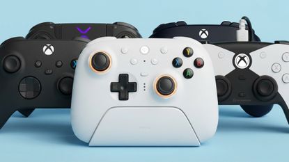 PC controllers on a sky blue backdrop