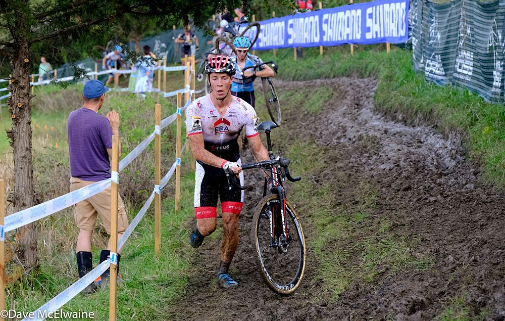 Laurens Sweeck (BEL) running in third place on a long muddy section of the course