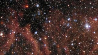 This Hubble Space Telescope image shows open cluster BSDL 2757, located in the dwarf galaxy the Large Magellanic Cloud. 