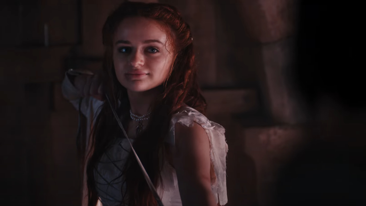 Joey King stands in a fighting stance in The Princess.