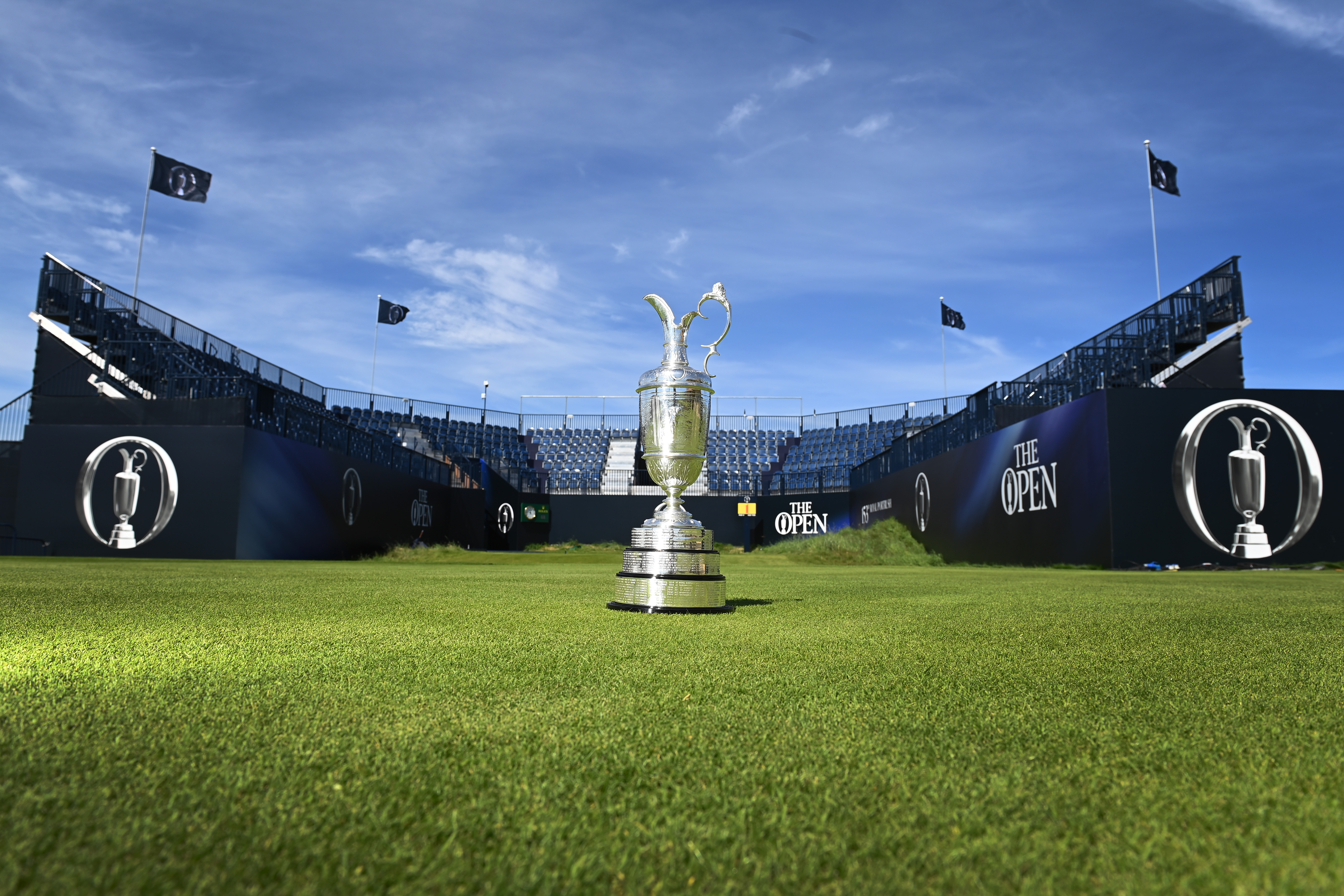 The Claret Jug in front of a grandstand