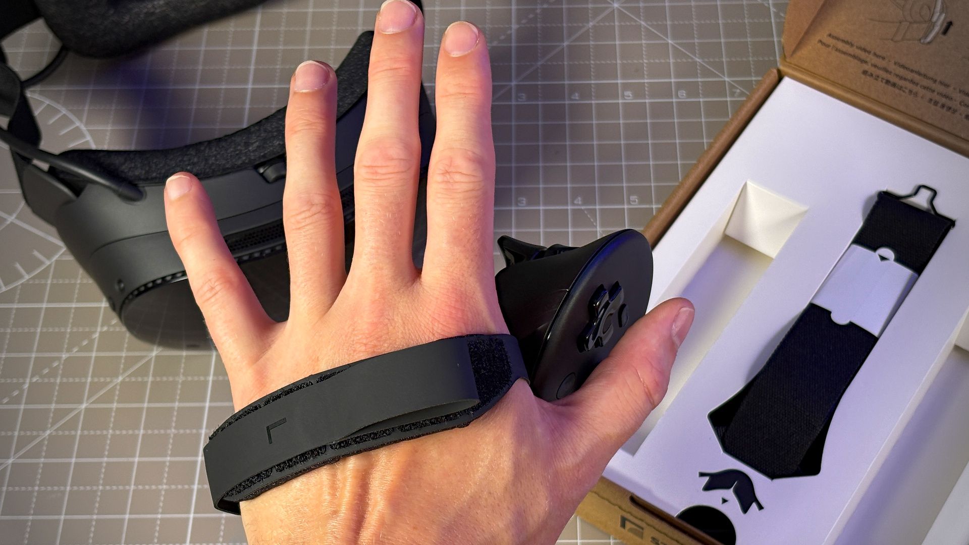 The Steam Frame controller with the ergonomic grip attached.