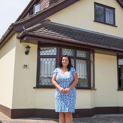 house exterior with lady with blue dress