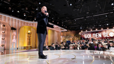Jo Koy on stage presenting the 2024 Golden Globes