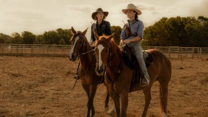 Anna Torv as Emily Lawson and Phillippa Northeast as Susie Lawson, both on horseback in the Australian outback, in &#039;Territory&#039;