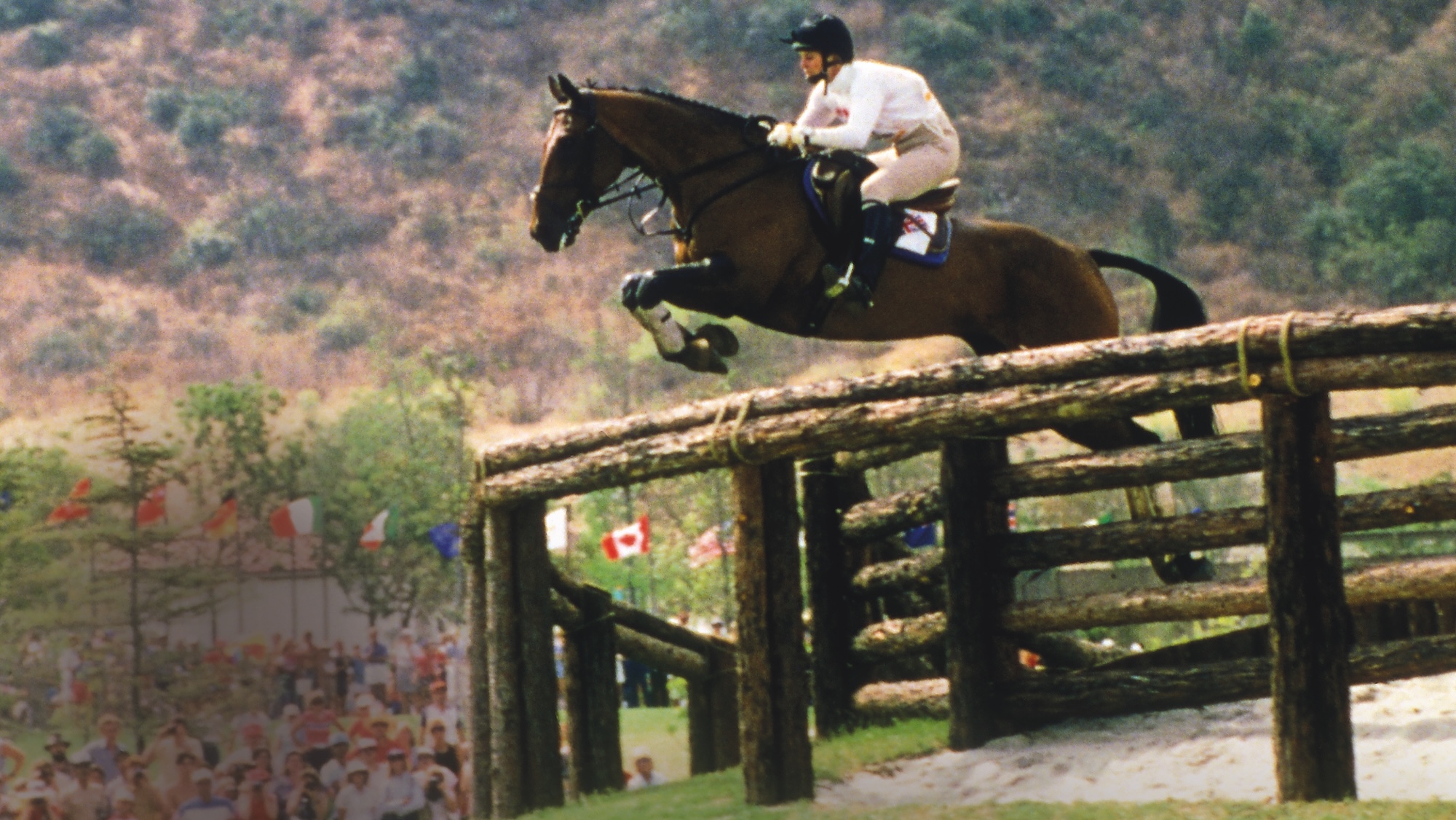 Ginny Elliot jumping huge cross-country fence at LA Olympics 