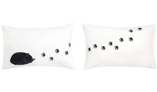 black cat and cat foot printed white pillows