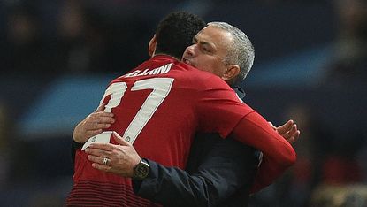 Manchester United midfielder Marouane Fellaini celebrates his winner with manager Jose Mourinho 