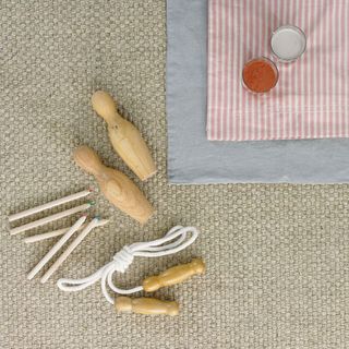sisal flooring with wooden pin and skipping rope on it