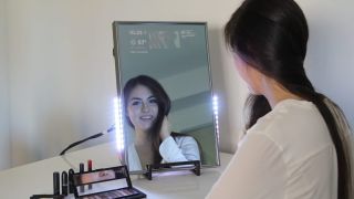 Image of woman using a smart mirror