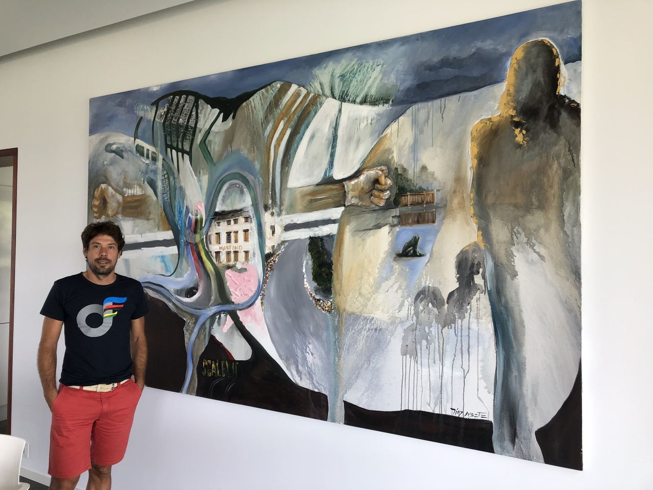 Oscar Freire shows off artwork around his house. In this piece the shadows on the left represent his family. You can also see the rainbow stripes, while above the pink section is the hotel he and the Spanish team stayed at. To the right of that is the final corner where Freire attacked in Verona.