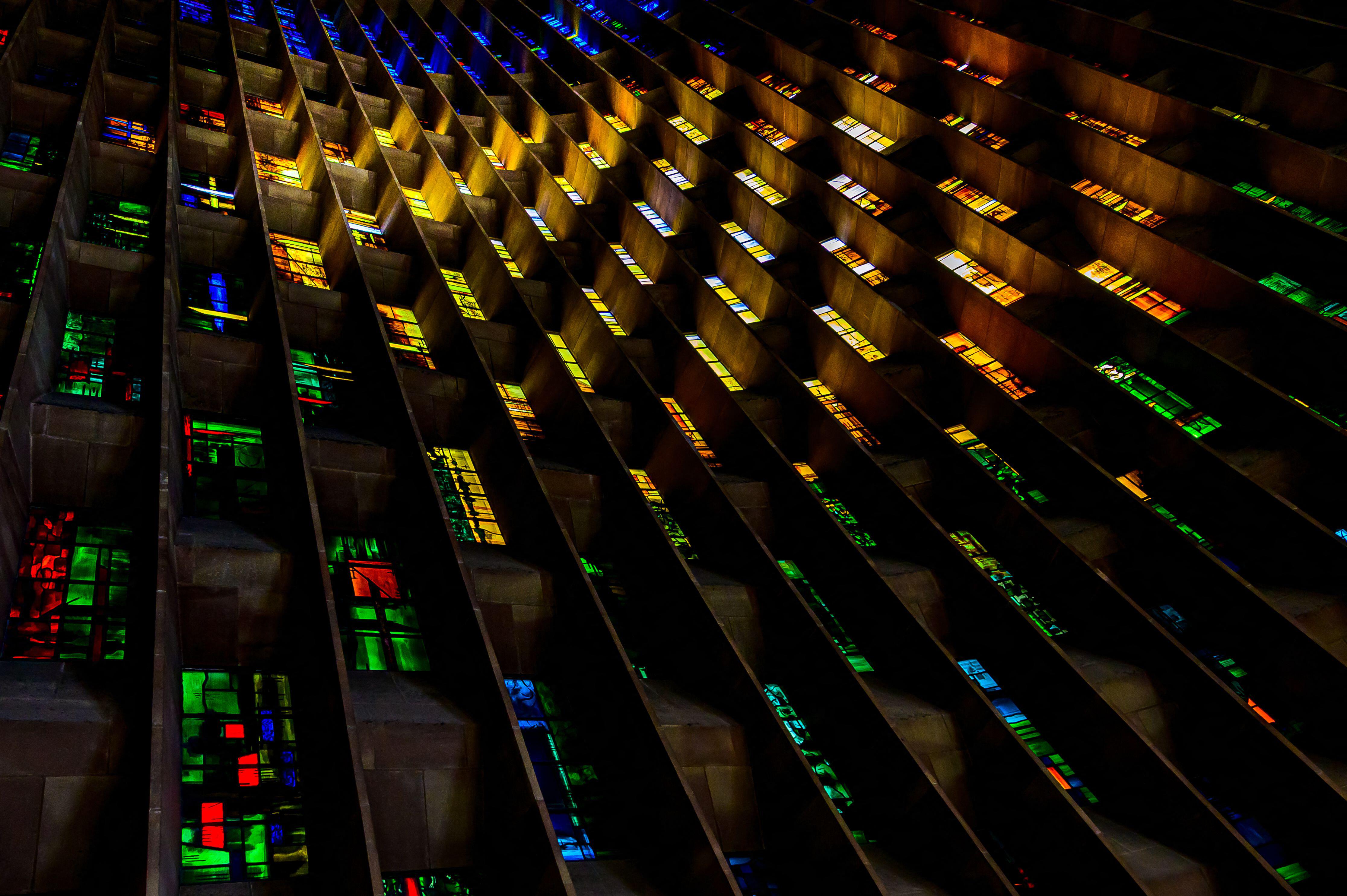 3D57E2A Baptistry window at Coventry Cathedral with sunlight illumination the stained glass