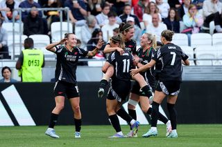 Mariona Caldentey of Arsenal celebrates scoring her team's second goal with team mate Katie McCabe during the UEFA Women's Champions League semifinal second leg match between Olympique Lyonnais and Arsenal WFC at OL Stadium on April 27, 2025 in Decines-Charpieu, France.