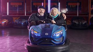 Larry Lamb and Alison Steadman sit together in a blue dodgem car in Alison & Larry: Billericay to Barry.