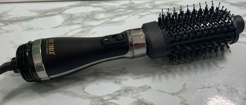 The Hot Tools Volumiser Set 2-in-1 Brush and Dryer on a marble countertop