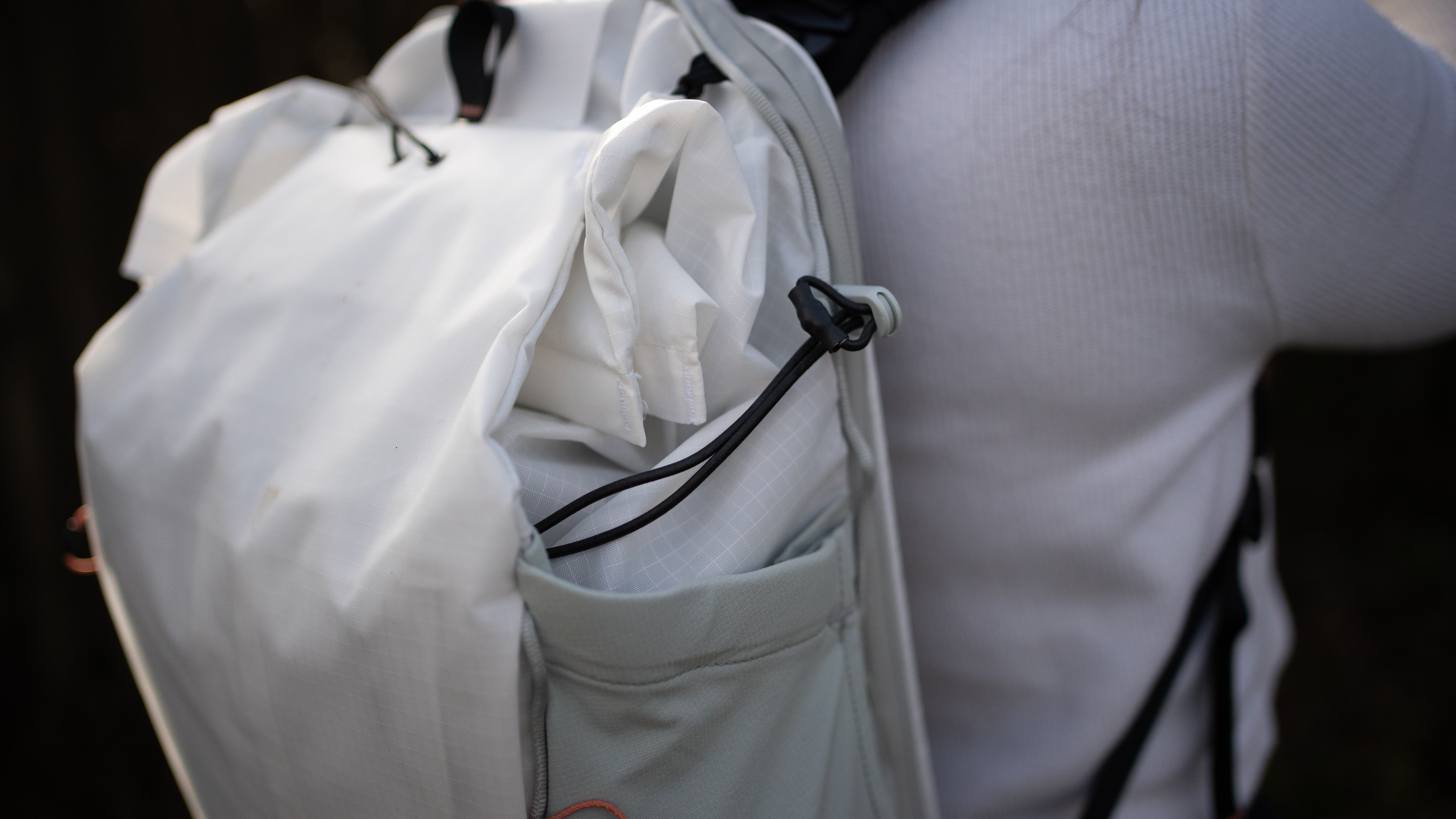 woman wearing the peak design outdoor bag in a nature reserve