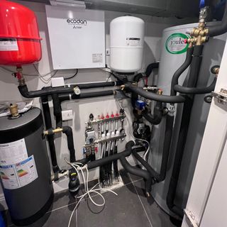 Air source heat pump tanks plumbing indoors