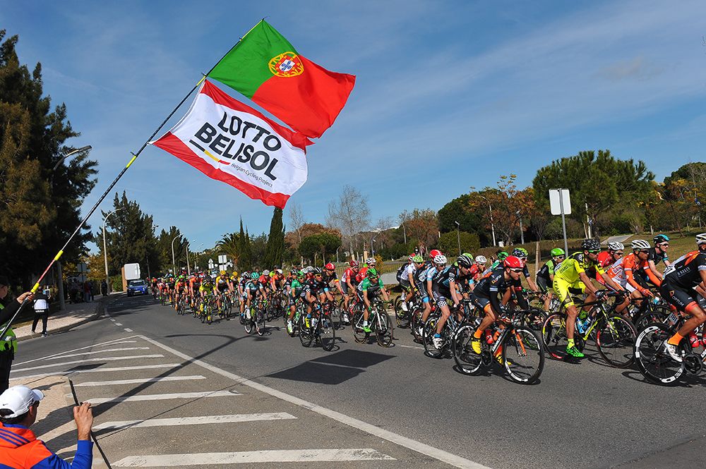 A Portuguese-Lotto Soudal flag flies in the wind
