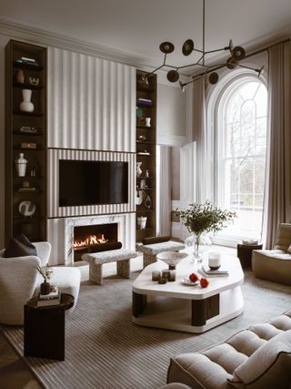 Neutral living room with TV in the fireplace