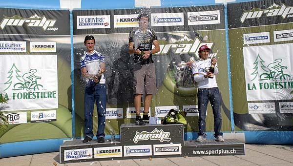 Champagne for the scratch category podium (Alexis Vuillermoz in second, Fran&ccedil;ois Bailly-Ma&icirc;tre in first, Miguel Martinez in third)