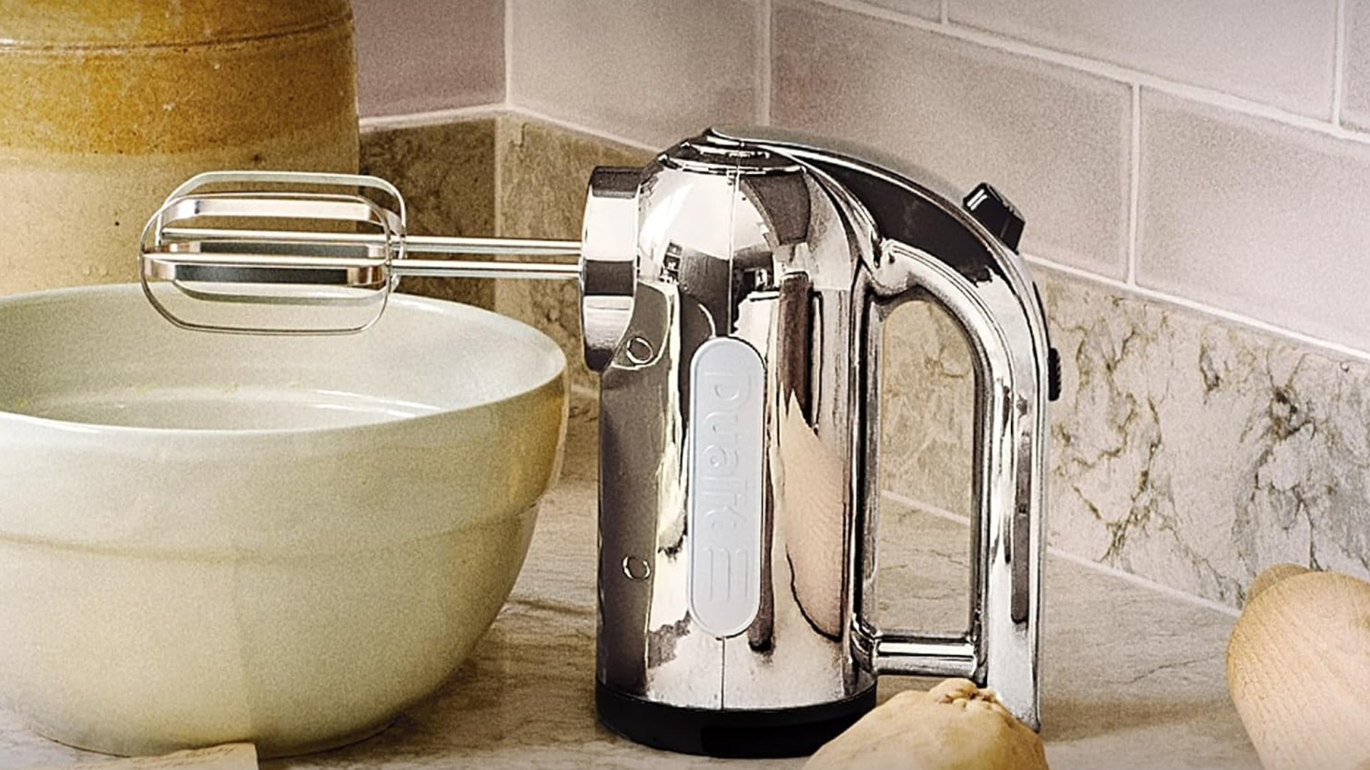 Dualit Hand Mixer on the counter in a kitchen around baking