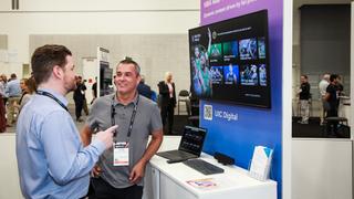 Ryan Milroy of UIC Digital, left, and Kalem Fletcher of UIC Centric at an NAB Show booth demo.