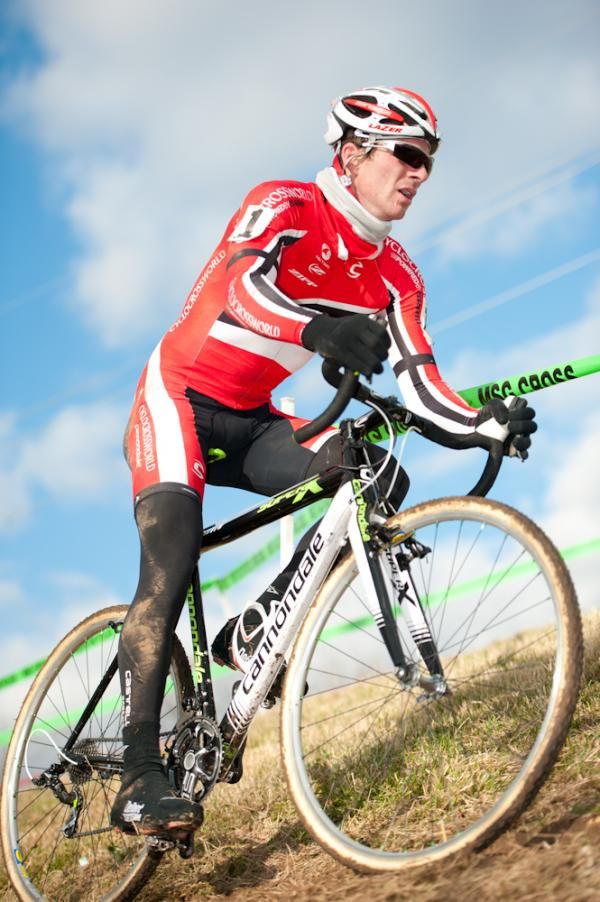 Dylan McNicholas rolls through the off-camber river bank